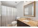 Bathroom with granite countertops, shower-tub combo, and dark vanity at 315 Stanyan Pl, Alpharetta, GA 30022