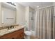 Bathroom features granite countertop vanity and shower with tub at 315 Stanyan Pl, Alpharetta, GA 30022