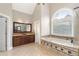 Bathroom with dual sinks, a walk-in shower, a garden tub, and tile floors at 315 Stanyan Pl, Alpharetta, GA 30022