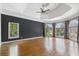 Spacious bedroom with dark accent wall, trey ceilings, a ceiling fan, and an abundance of natural light at 315 Stanyan Pl, Alpharetta, GA 30022