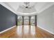 Large bedroom offering a tray ceiling, ceiling fan, and lots of windows with nice views of the outdoors at 315 Stanyan Pl, Alpharetta, GA 30022