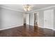 Spacious bedroom with hardwood floors, white trim, and ensuite bathroom at 315 Stanyan Pl, Alpharetta, GA 30022