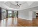 Large bedroom with tray ceilings and views of the well-maintained yard through the wall of windows at 315 Stanyan Pl, Alpharetta, GA 30022