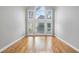 Bright bedroom features a wall of windows, hardwood floors, and great light at 315 Stanyan Pl, Alpharetta, GA 30022