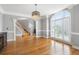 Spacious dining room featuring hardwood floors, large windows, and elegant architectural details at 315 Stanyan Pl, Alpharetta, GA 30022
