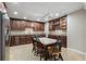 Large kitchen and dining area with wooden cabinets and seating for six at 315 Stanyan Pl, Alpharetta, GA 30022