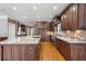 Well-lit kitchen boasts custom cabinetry, stainless appliances, and a large island with a sink at 315 Stanyan Pl, Alpharetta, GA 30022
