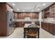 Spacious kitchen features stainless steel appliances, granite countertops, and dark wood cabinets at 315 Stanyan Pl, Alpharetta, GA 30022