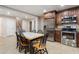 Kitchen features stainless appliances, granite countertops, and a cozy dining area at 315 Stanyan Pl, Alpharetta, GA 30022
