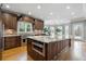 Gourmet kitchen features a large island, custom cabinetry, stainless steel appliances, and granite countertops at 315 Stanyan Pl, Alpharetta, GA 30022