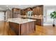 Gourmet kitchen features custom cabinets, stainless appliances, a large island, and hardwood floors at 315 Stanyan Pl, Alpharetta, GA 30022