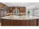 Spacious kitchen features a large island with a marble countertop and custom cabinetry at 315 Stanyan Pl, Alpharetta, GA 30022