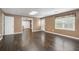 This spacious living room boasts hardwood floors, neutral walls, natural light, and open doorways at 315 Stanyan Pl, Alpharetta, GA 30022