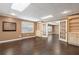 Elegant living room with hardwood floors, built-in shelves, neutral walls, and natural light at 315 Stanyan Pl, Alpharetta, GA 30022
