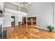 Spacious living room with hardwood floors, wet bar, and an open view to the kitchen and second story at 315 Stanyan Pl, Alpharetta, GA 30022