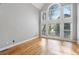 Bright living room with hardwood floors and a large window offering plenty of natural light at 315 Stanyan Pl, Alpharetta, GA 30022