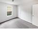 Bright bedroom with natural light, neutral colors and carpet at 4661 Cedar Park Trl, Stone Mountain, GA 30083