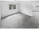 A bedroom featuring a neutral carpet, large window and a bright entry at 4661 Cedar Park Trl, Stone Mountain, GA 30083