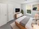 Cozy bedroom featuring a large window and a dresser at 4661 Cedar Park Trl, Stone Mountain, GA 30083