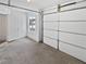 Spacious garage with overhead door, access door, and window providing natural light at 4661 Cedar Park Trl, Stone Mountain, GA 30083