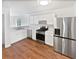 Updated kitchen with stainless steel appliances and white cabinets at 4661 Cedar Park Trl, Stone Mountain, GA 30083