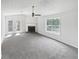 Bright living room featuring a fireplace and double doors at 4661 Cedar Park Trl, Stone Mountain, GA 30083