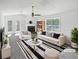 Bright living room with fireplace, ample seating, and large window at 4661 Cedar Park Trl, Stone Mountain, GA 30083