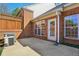 A cozy back patio with brick accents, a lattice fence, and an air conditioning unit adds outdoor charm to this house at 132 Westchester Se Dr, Smyrna, GA 30082