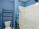 A bathroom with a tiled shower and a colorful shower curtain at 132 Westchester Se Dr, Smyrna, GA 30082
