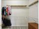 Organized walk-in closet with metal shelving, hanging racks, and a wooden dresser at 132 Westchester Se Dr, Smyrna, GA 30082