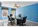 A conference room with a large table, comfortable seating, and windows at 132 Westchester Se Dr, Smyrna, GA 30082