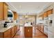 Bright eat-in kitchen features white appliances, central island and hardwood floors at 132 Westchester Se Dr, Smyrna, GA 30082