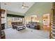 Inviting living room with neutral color palette, vaulted ceiling, and plush seating at 132 Westchester Se Dr, Smyrna, GA 30082