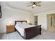 Spacious main bedroom features a tray ceiling, ceiling fan, and neutral carpeting at 132 Westchester Se Dr, Smyrna, GA 30082