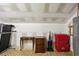 Storage room with treadmill, small dresser, storage containers, and tile floor at 132 Westchester Se Dr, Smyrna, GA 30082