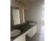 Bathroom featuring a dual sink and vanity, offering a modern and convenient space to use at 4423 Roche St, Atlanta, GA 30349