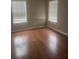 Bedroom with wood floors and windows, offering a comfortable and well-lit space at 4423 Roche St, Atlanta, GA 30349