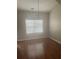 Dining area with hardwood floors, modern lighting, and a window offering natural light at 4423 Roche St, Atlanta, GA 30349