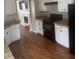 Functional kitchen with white cabinets and appliances including a black range at 4423 Roche St, Atlanta, GA 30349