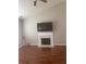 Bright living room with vaulted ceiling, fireplace, and hardwood floors at 4423 Roche St, Atlanta, GA 30349
