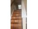 Stairs leading to upper level with decorative tile and a window providing natural light at 4423 Roche St, Atlanta, GA 30349