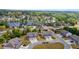 Aerial view of neighborhood featuring manicured lawns and mature trees near a lake at 7200 Brigidoon Rose, Douglasville, GA 30134