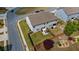 Aerial view of a fenced backyard with a patio, shed, and lush green grass at 7200 Brigidoon Rose, Douglasville, GA 30134