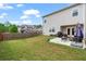 A spacious backyard features a well-kept lawn and a patio area perfect for outdoor gatherings at 7200 Brigidoon Rose, Douglasville, GA 30134
