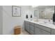 Beautiful bathroom with double sinks, framed art, and great lighting at 7200 Brigidoon Rose, Douglasville, GA 30134