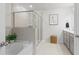 Modern bathroom featuring a soaking tub, glass-enclosed shower, and neutral finishes at 7200 Brigidoon Rose, Douglasville, GA 30134