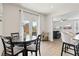 Inviting dining area with backyard access, stylish lighting, and modern finishes at 7200 Brigidoon Rose, Douglasville, GA 30134