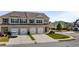 Attractive townhome with a 3 car garage, a well manicured lawn and beautiful curb appeal at 7200 Brigidoon Rose, Douglasville, GA 30134