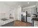 Modern kitchen featuring stainless steel appliances, granite countertops and ample cabinet space at 7200 Brigidoon Rose, Douglasville, GA 30134