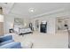 Bright main bedroom with tray ceiling, neutral carpet, and an ensuite bathroom at 7200 Brigidoon Rose, Douglasville, GA 30134